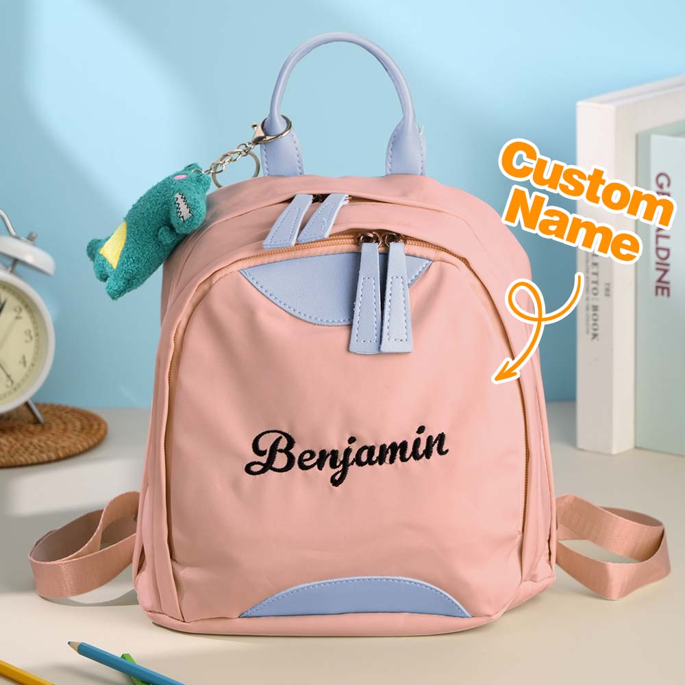 Oxford fabric and high-quality stitching close-up on personalised mini backpack – durable custom school bag with embroidered name detail
