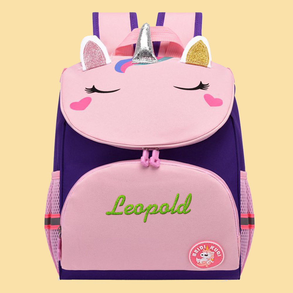 Child wearing a personalised unicorn backpack with custom name embroidery – stylish and durable school bag for kids