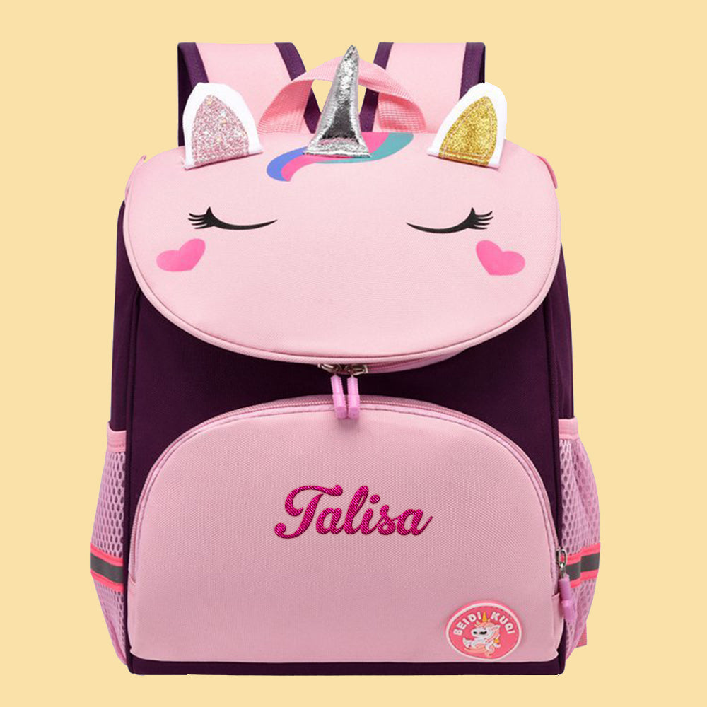Detail of unicorn motif and sturdy zip on personalised embroidered backpack – high-quality custom school bag finishing