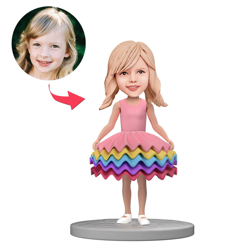 Personalised polymer clay little girl bobblehead in colourful skirt with engraved text on base, custom head likeness