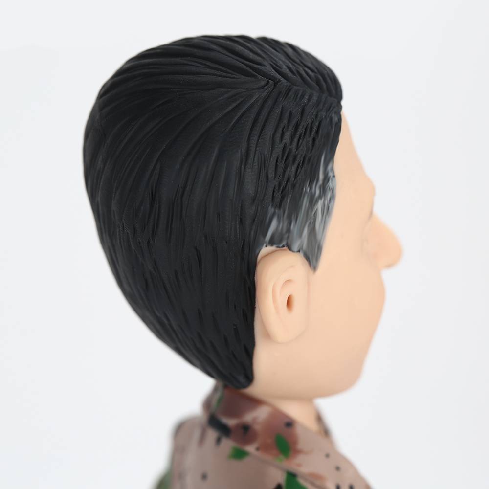 Detail of engraved base with custom name and message on personalised soldier bobblehead — engraved bobblehead keepsake for service members