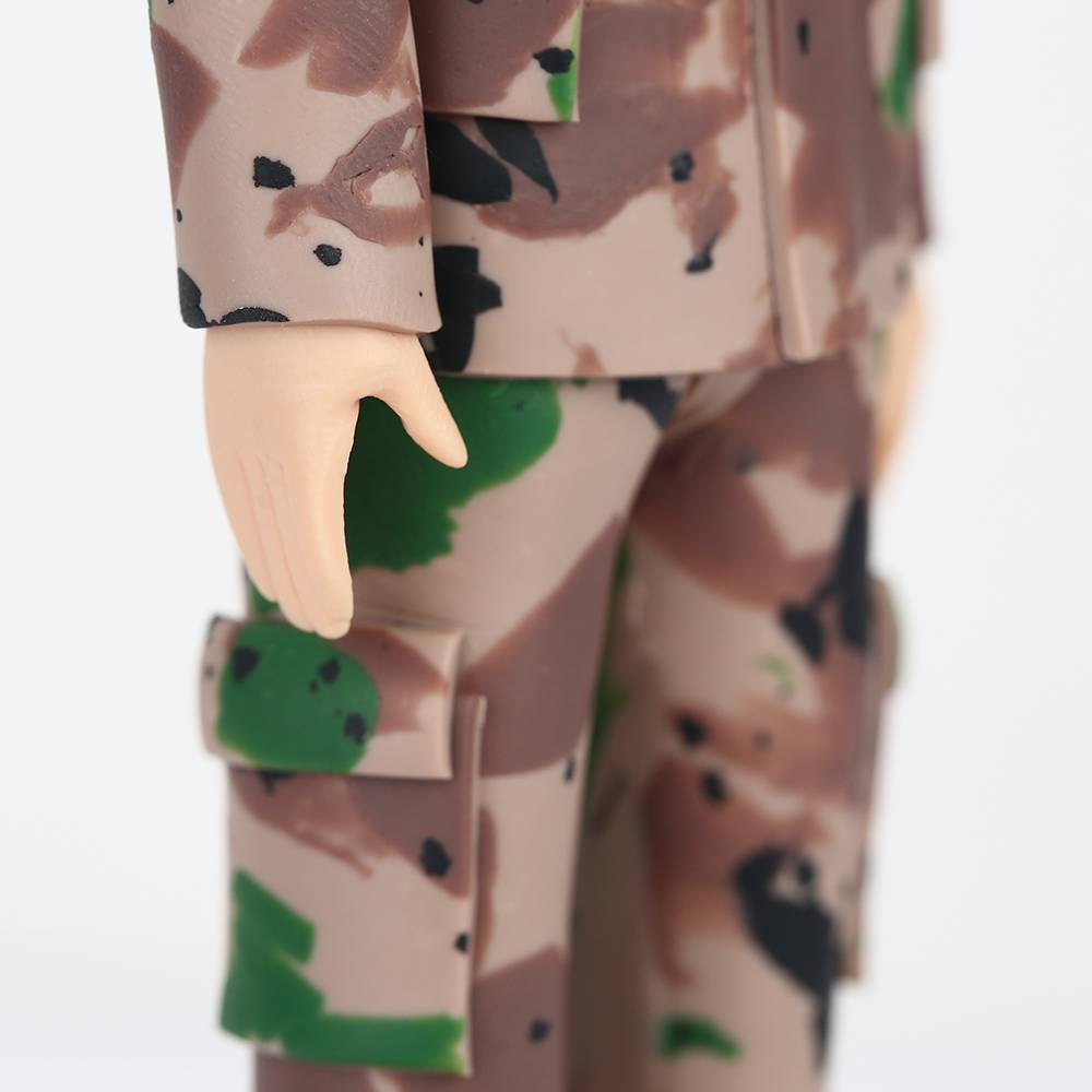 Side view of full-figure personalised soldier bobblehead displaying fixed pose and uniform details on a polymer clay figurine