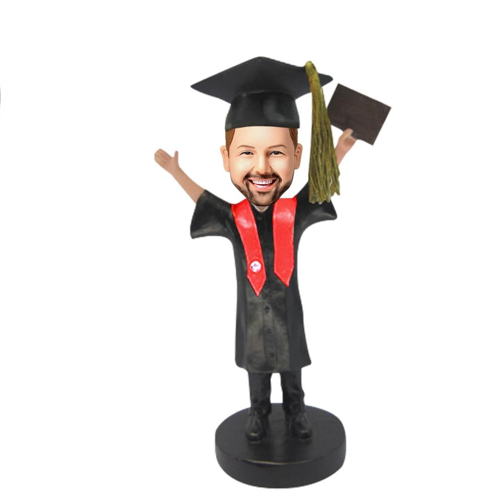Personalised graduation boy bobblehead with engraved base – polymer clay custom head from photo, boy in mortarboard and gown holding diploma, perfect engraved gift for son or teen