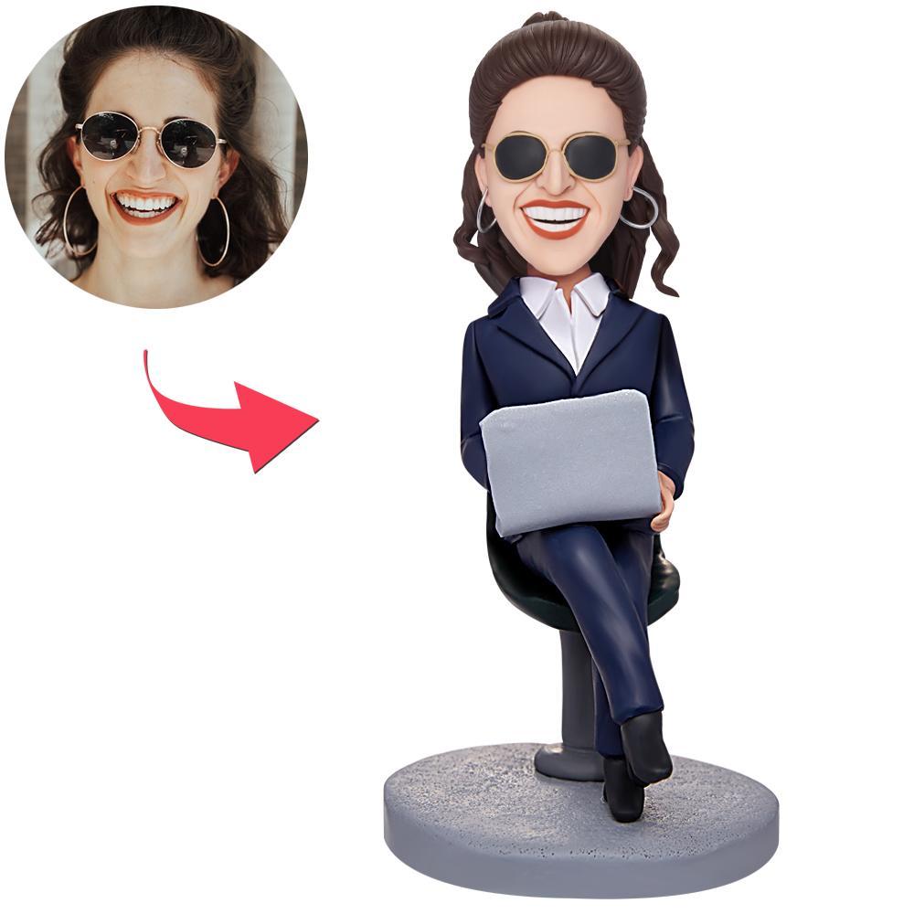 Custom engraved bobblehead of a female boss working with a laptop, personalised head matched to photo, polymer clay office gift