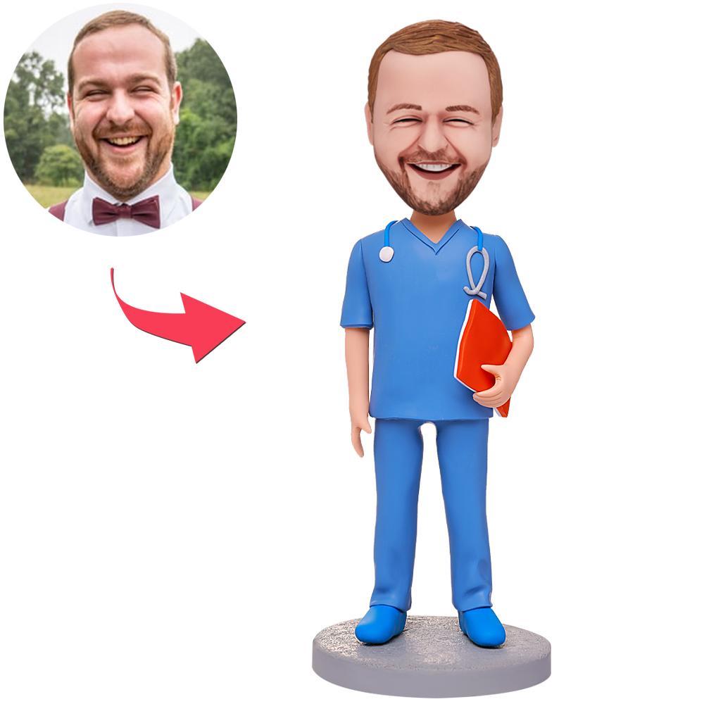 Male doctor with notebook personalised bobblehead – hand‑sculpted polymer clay bespoke doctor figurine with custom photo-to-bobblehead head and optional engraved text, ideal personalised GP gift or NHS doctor gift.