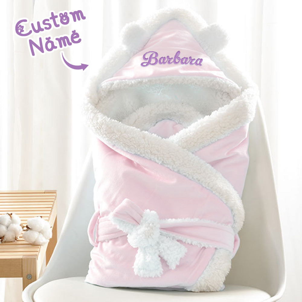 Baby wrapped in personalised embroidered swaddle — soft polyester custom name baby blanket ideal as a newborn or baby shower present