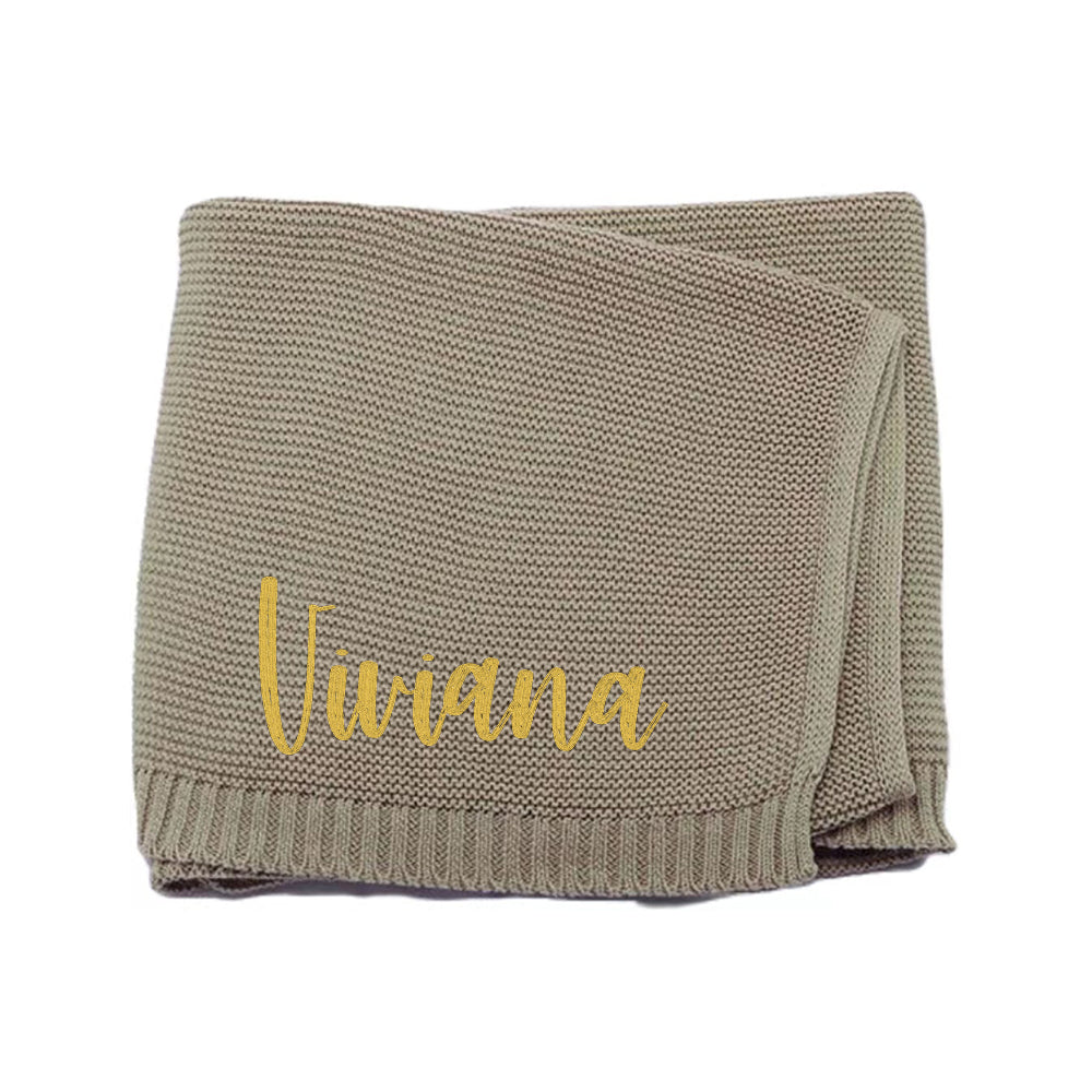 Warm knit blanket with natural lighting showing cosy fabric.