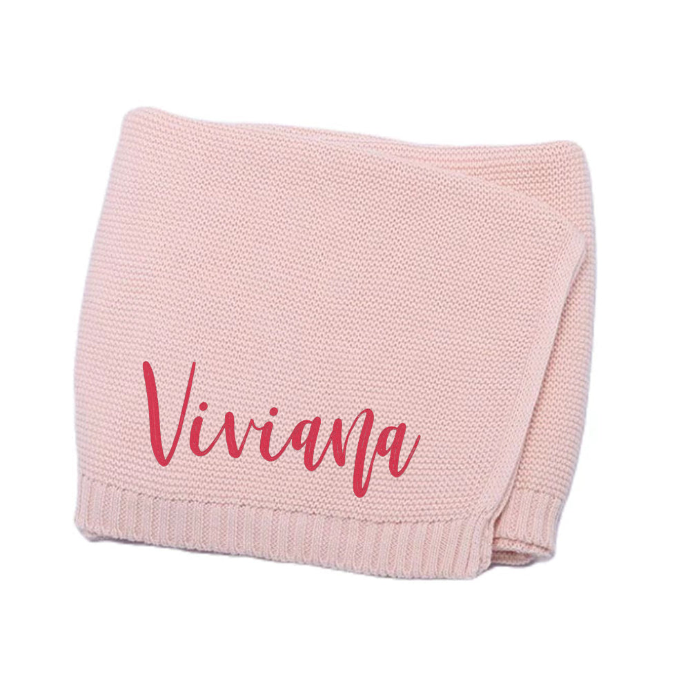 Embroidered name placement along the blanket width.