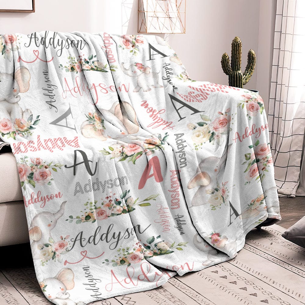 Blanket folded to reveal elephant motif and custom name on plush flannel