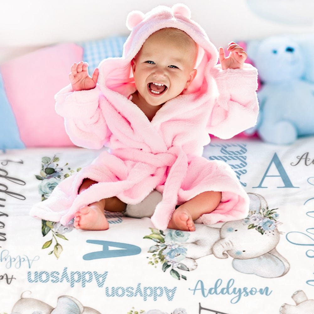 Soft flannel blanket showcasing floral elephant design and name