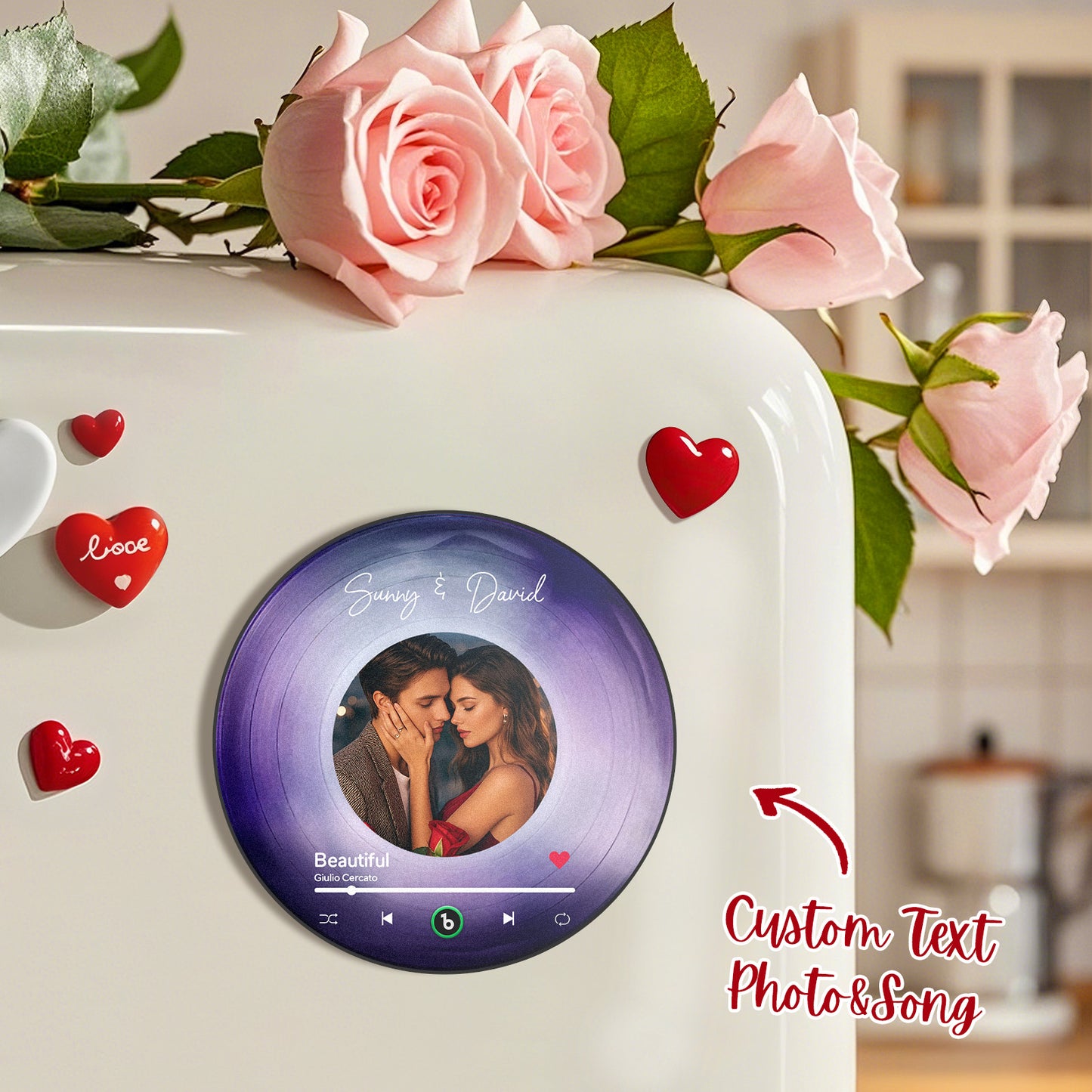 Heart-shaped FridgeBeats album magnet playing a tune on a kitchen fridge with magnetic backing visible — durable, low‑power personalised music fridge magnet keeps memories audible