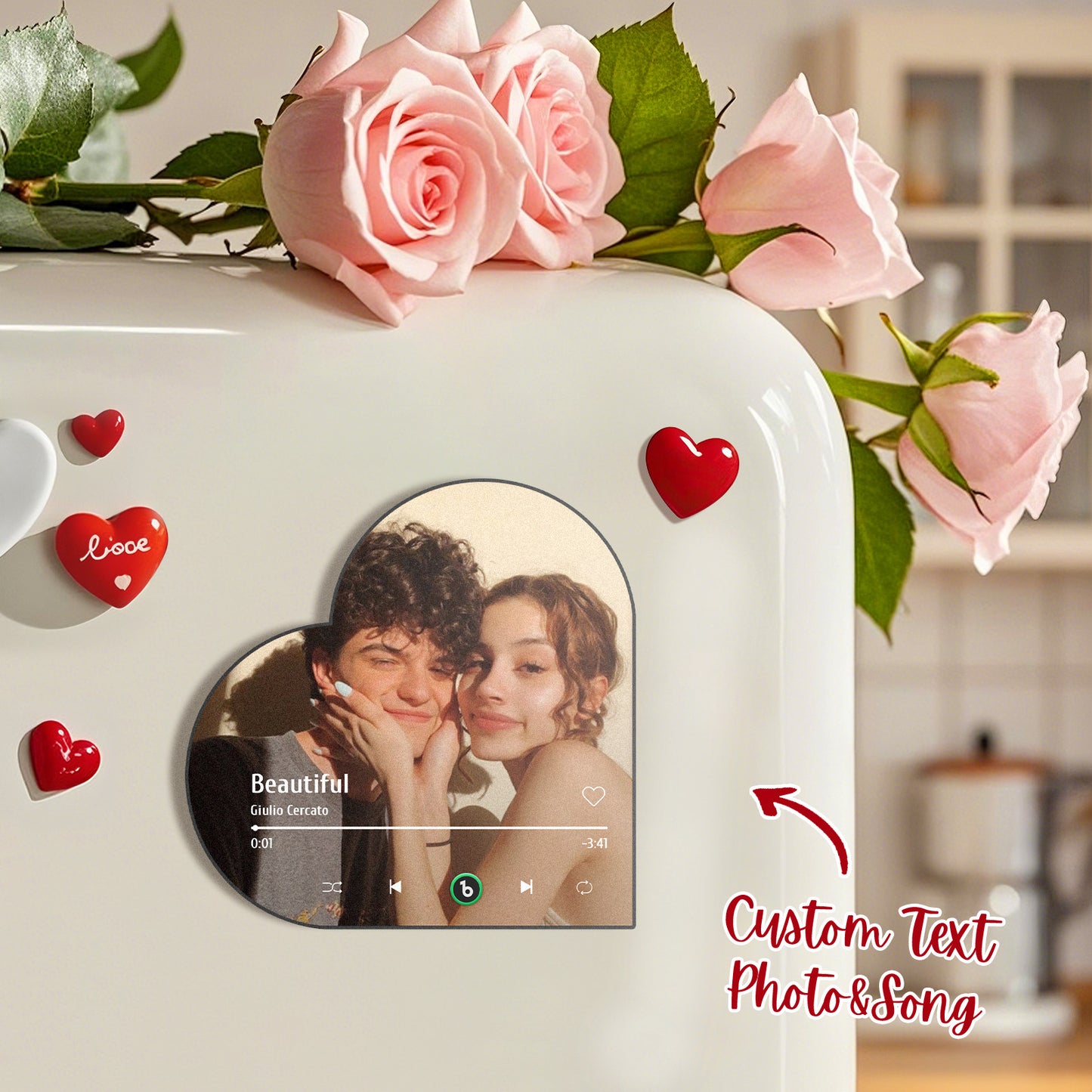 FridgeBeats personalised music fridge magnet in heart-frame album design showing a customised photo and play controls — personalised MP3-playing fridge magnet gift for couples