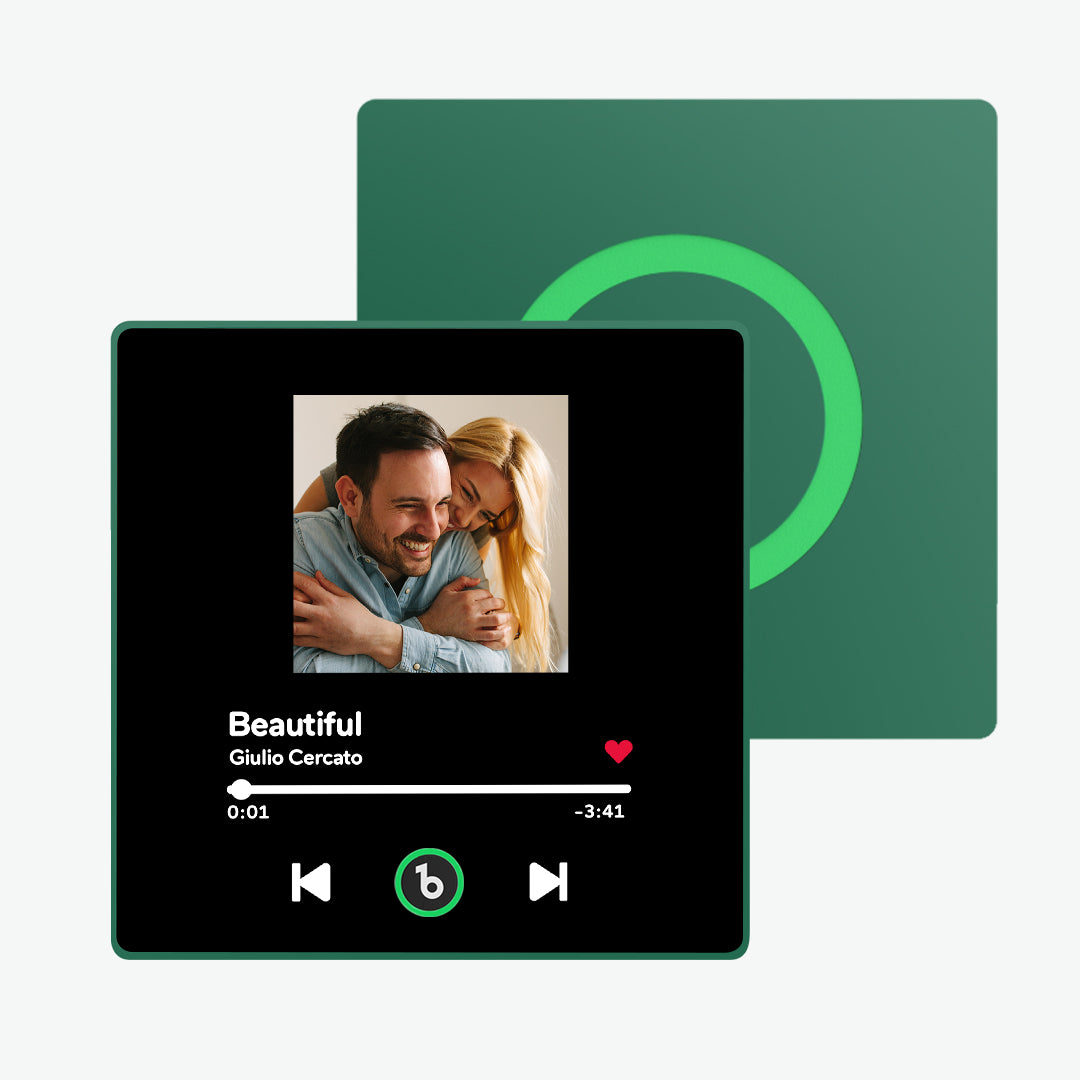 Hand holding 10cm FridgeBeats framed music magnet to show scale – compact personalised keepsake for couples and partners