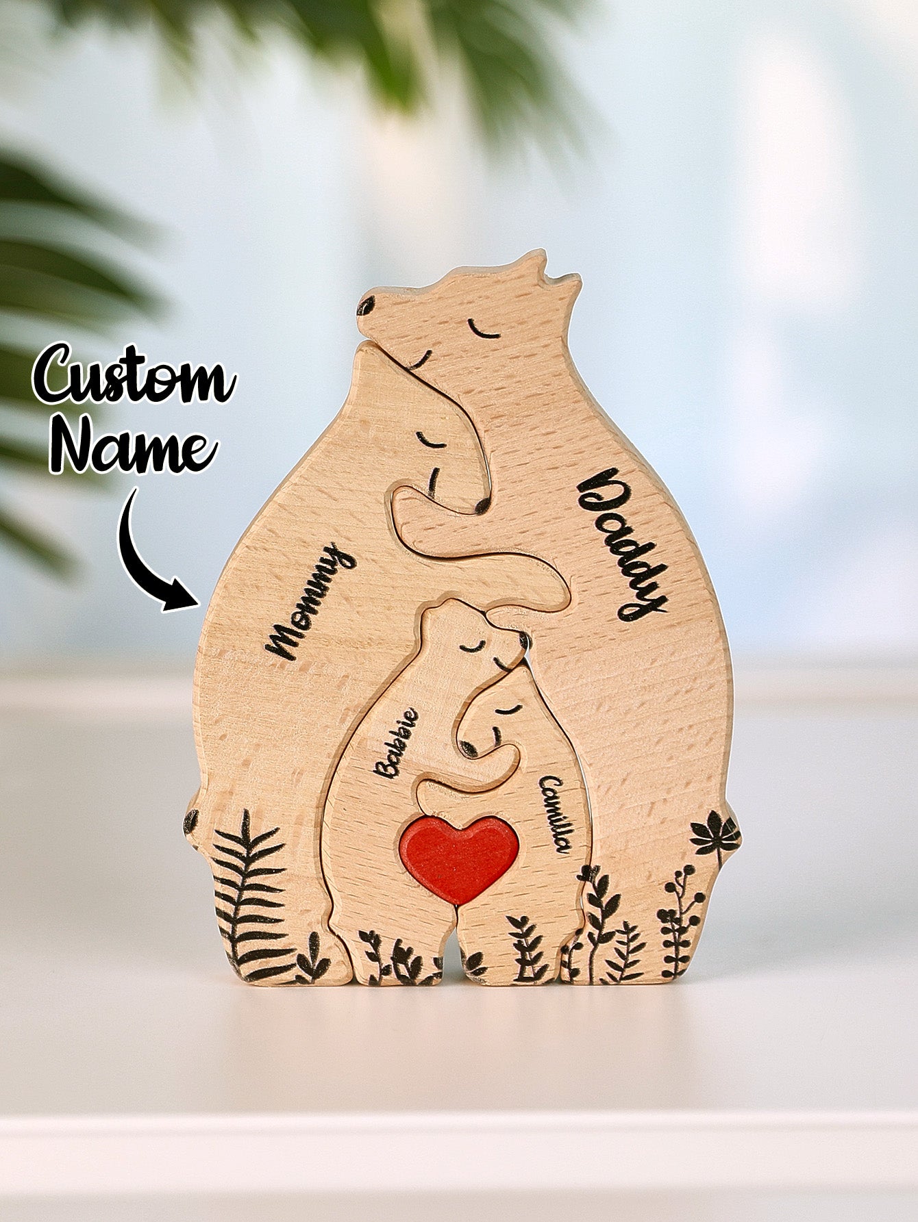 Top view of personalised wooden heart bear puzzle laid flat with each bear engraved with custom names – family keepsake gift
