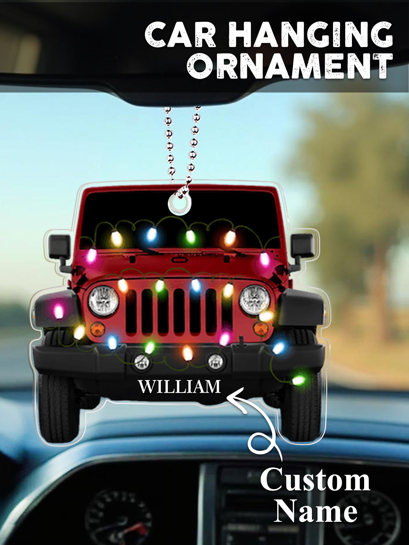 Lifestyle image of personalised car Christmas ornament hanging on a decorated tree, engraved name catching the light on clear acrylic