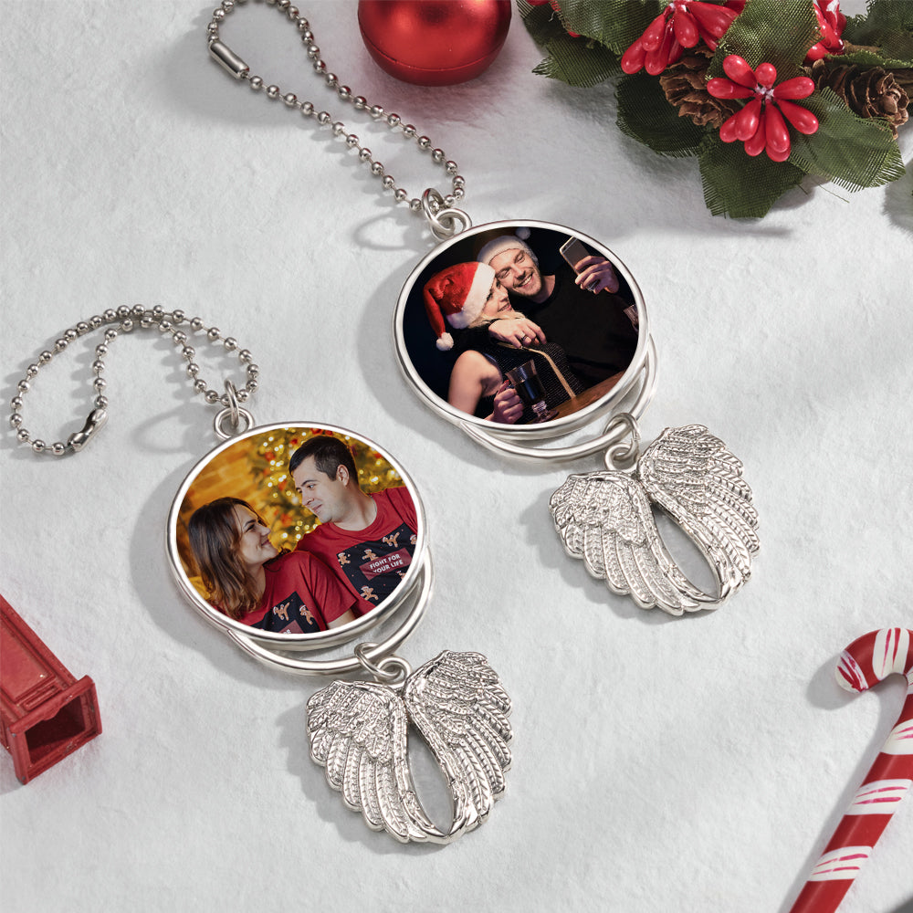 Close-up of the angel wings ornament showing a personalised photo on one side.