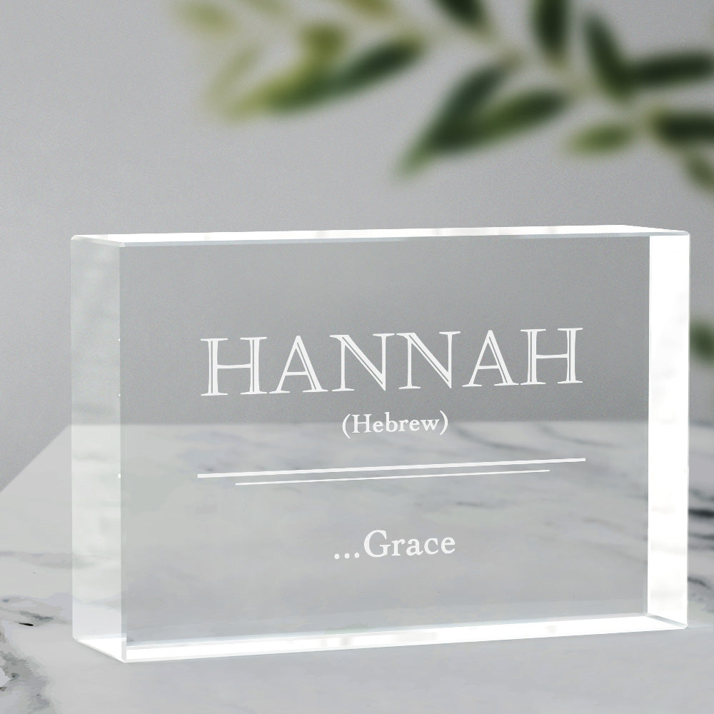 Close-up of engraved crystal glass name-meaning block showing precise internal 3D engraving and LED illuminated base, personalised ornament or engraved photo crystal