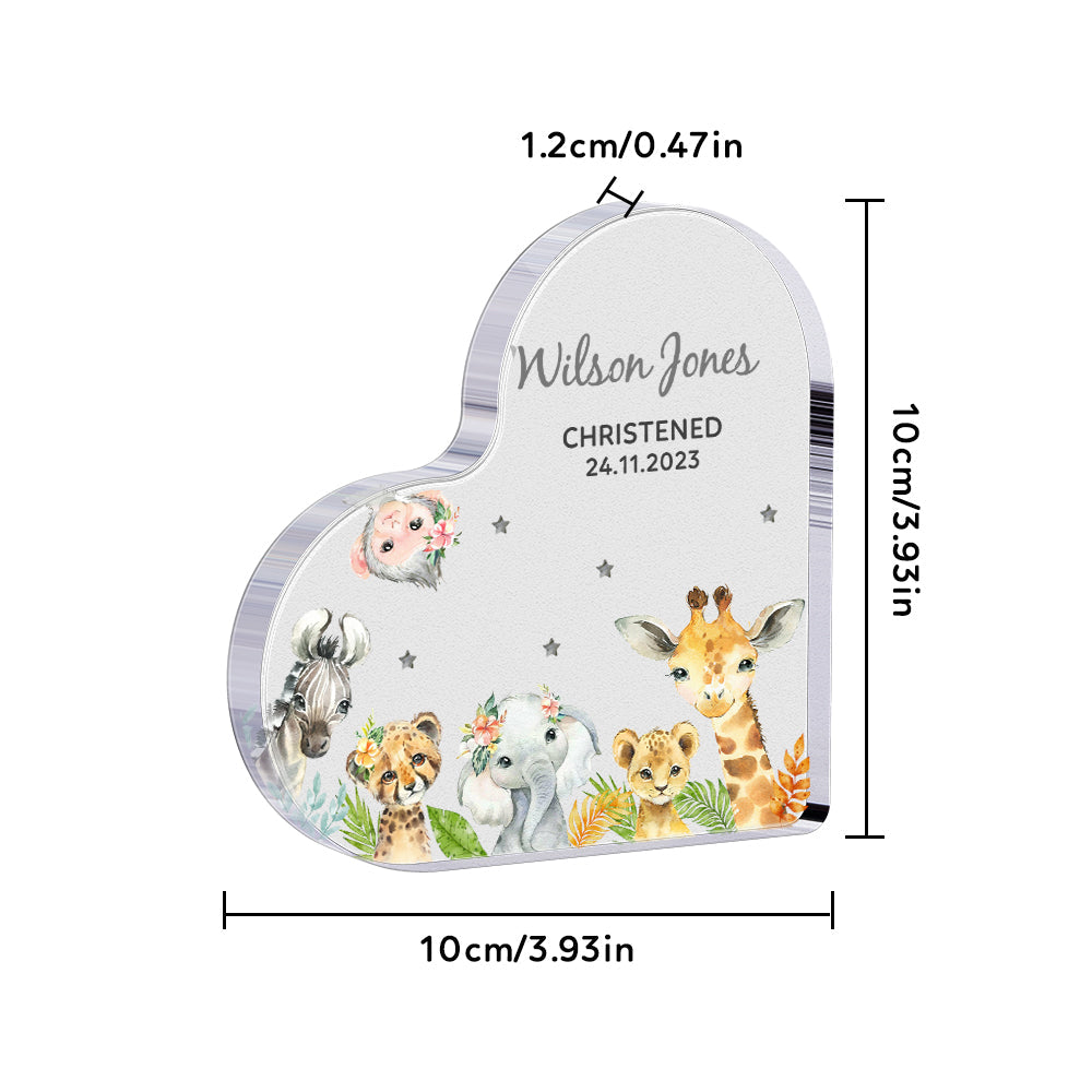 Angled shot of personalised acrylic heart block with engraved text and charming animal decorations — nursery display keepsake