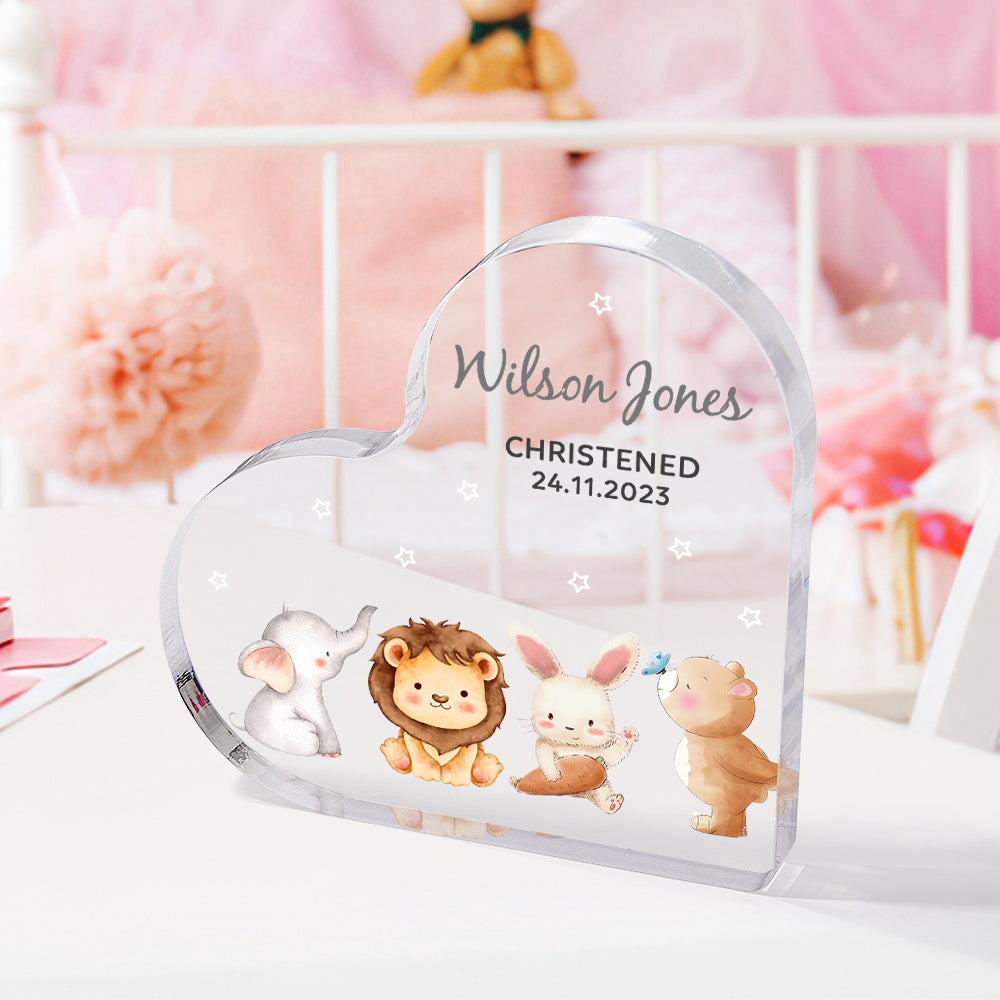 Detailed view of engraved acrylic heart ornament on stand — personalised christening or baptism keepsake