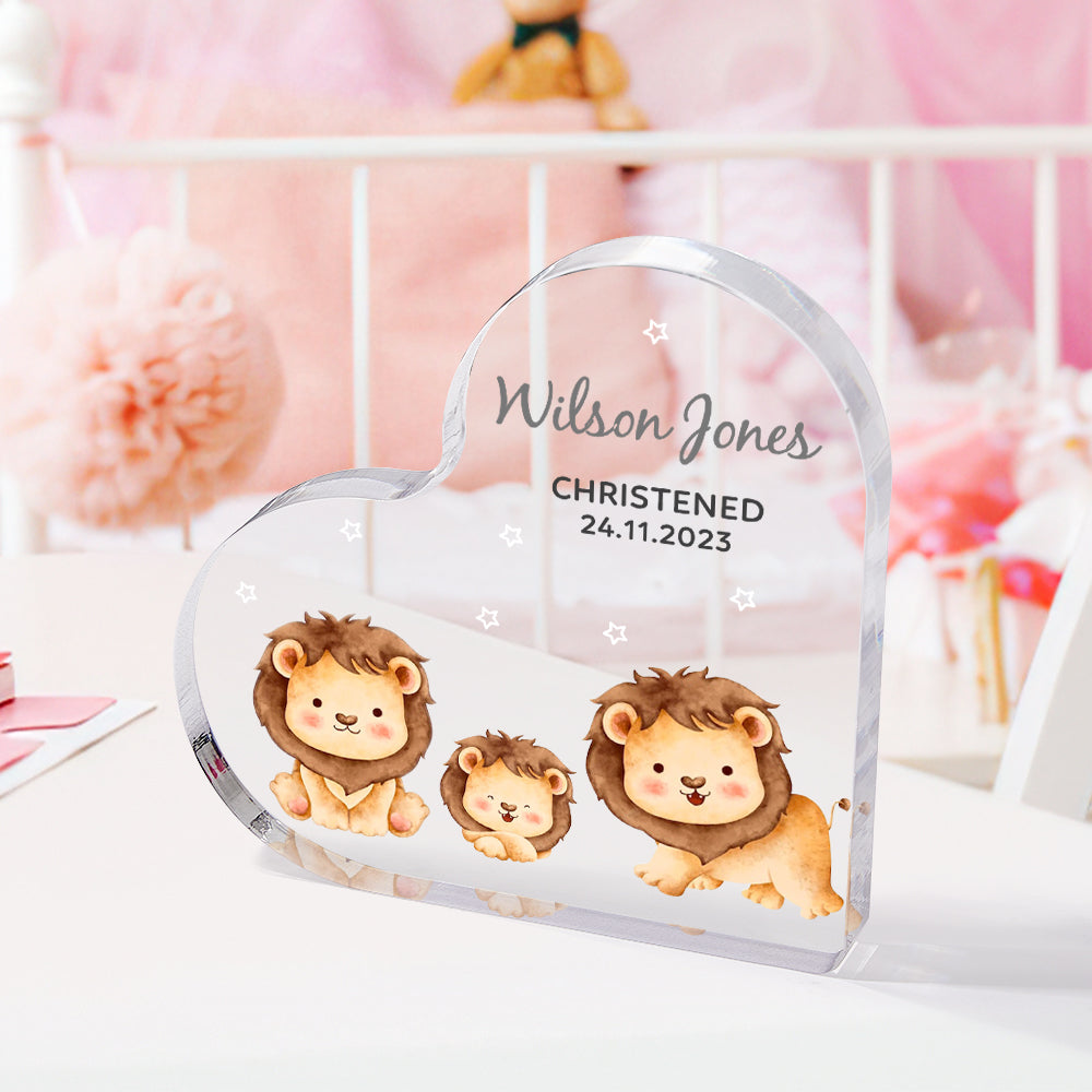 Lifestyle view of engraved acrylic heart ornament displayed in a nursery — personalised name and date keepsake