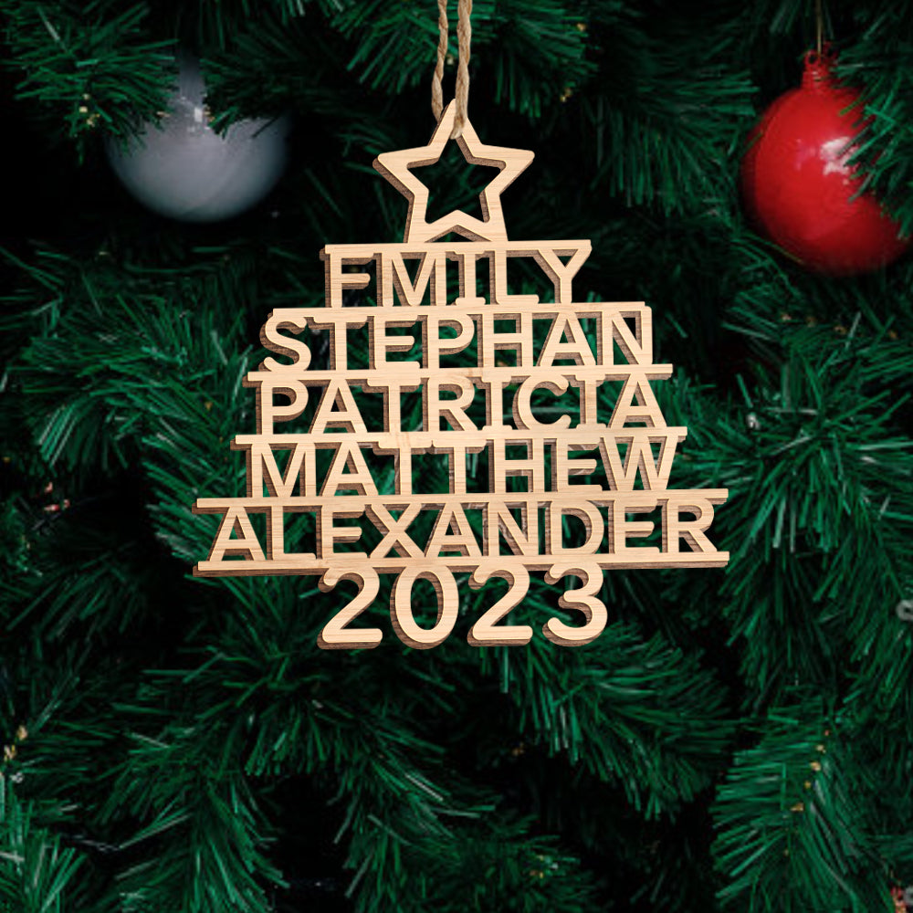 Close-up of engraved custom name on premium sustainable wood ornament, handcrafted personalised Christmas tree decoration with fine detail