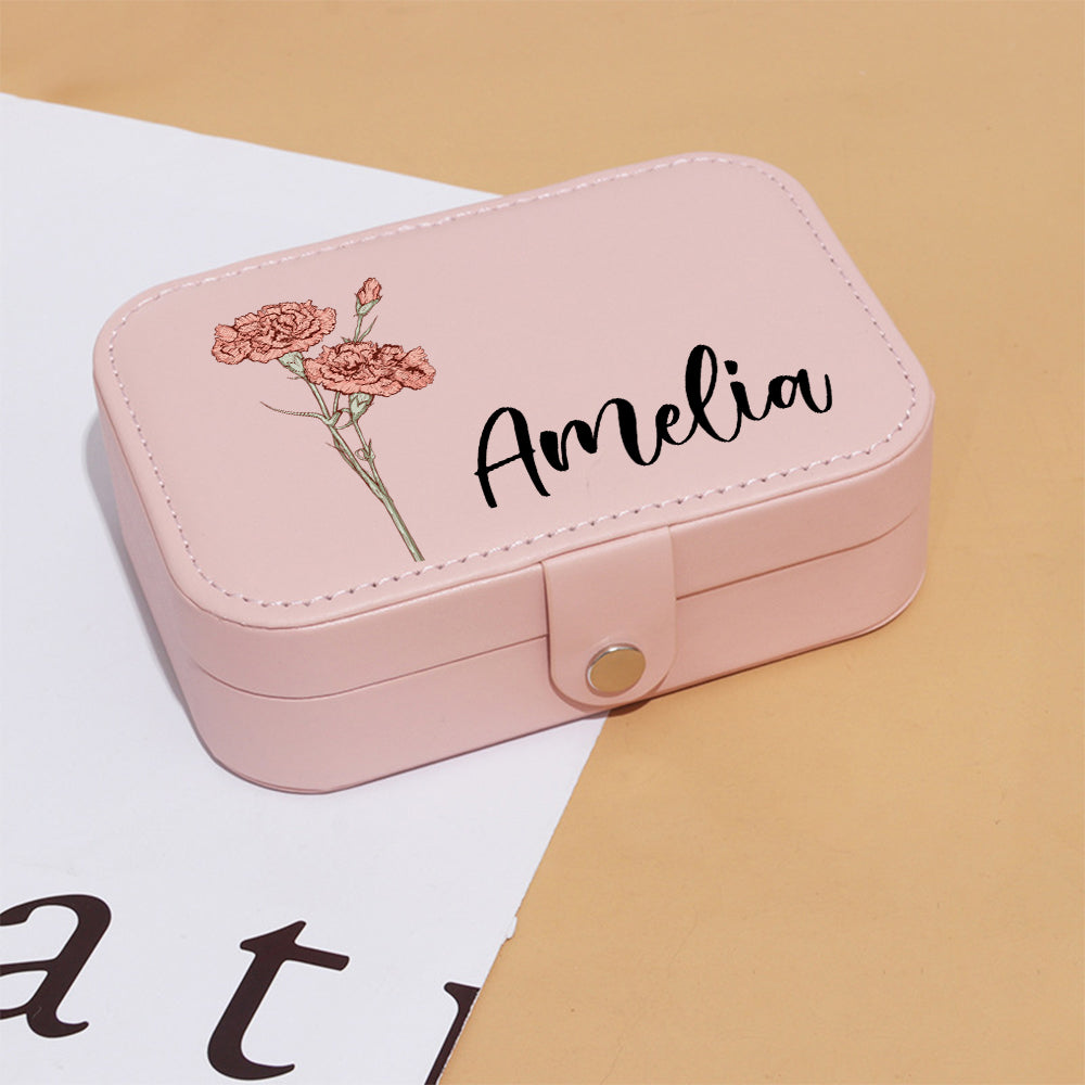 Travel jewellery organiser filled with rings, earrings and a bracelet — multi-compartment layout keeps jewellery organised