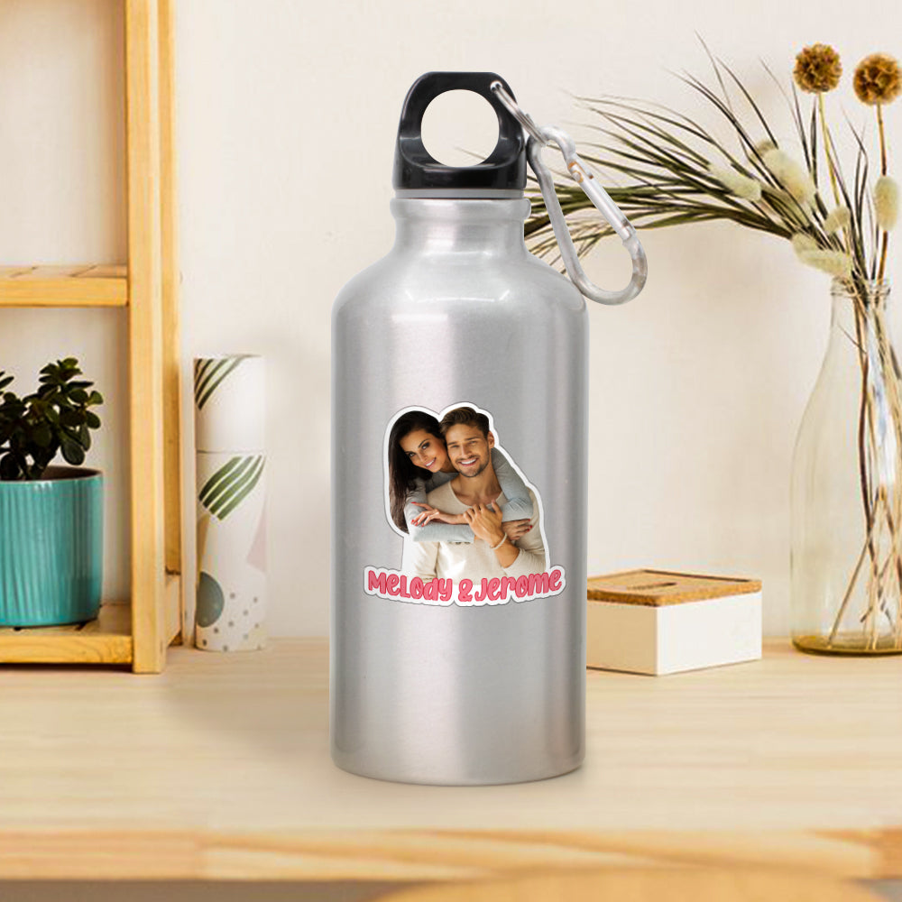 Close-up of a personalised couple photo sticker applied to a laptop — custom phone and laptop decal showing crisp, vibrant colours