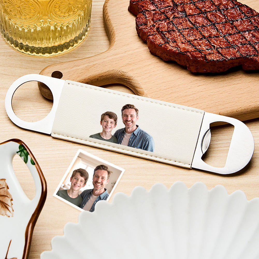 Side-angle view highlighting the personalised photo bottle opener's leather handle and polished metal head.