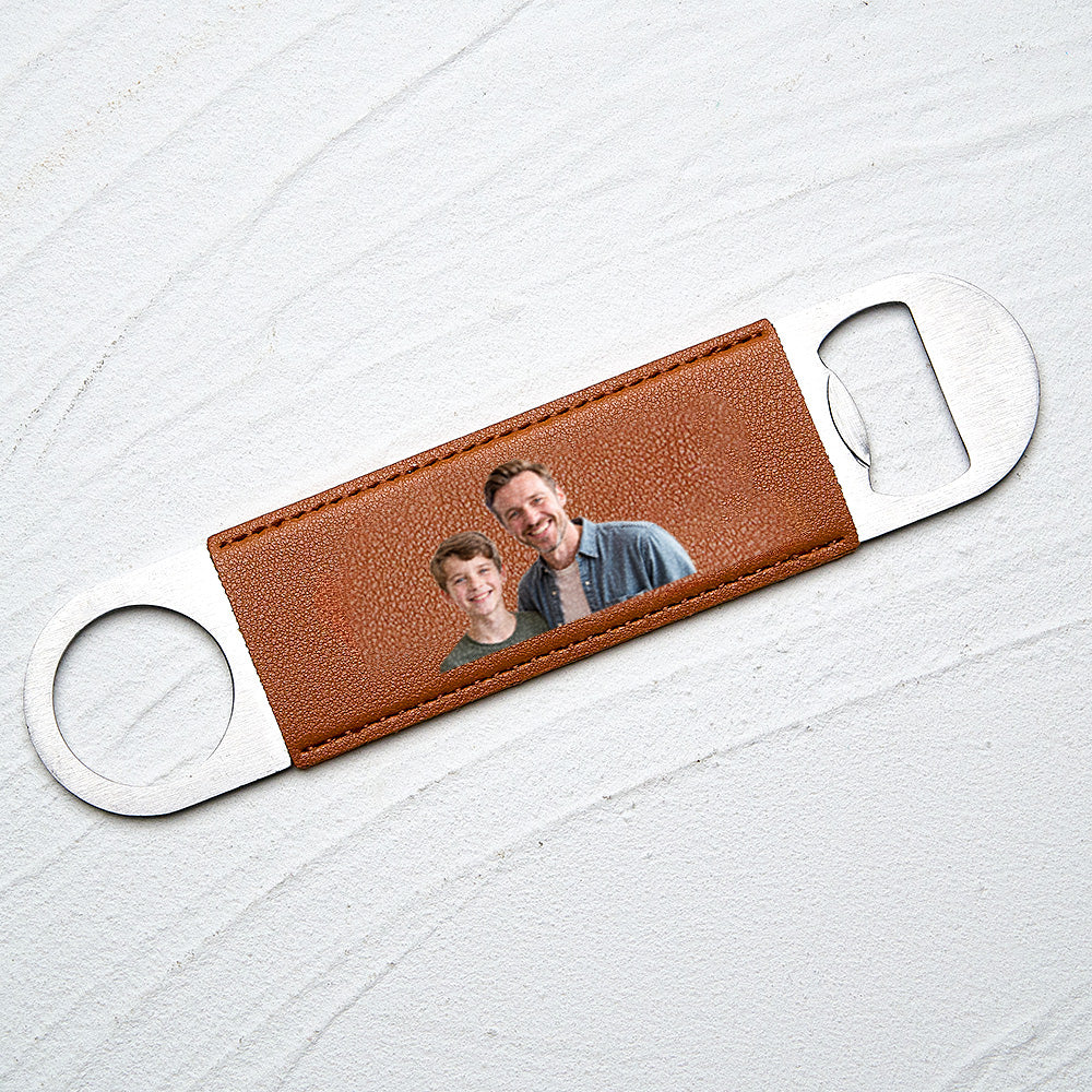 Close-up shot of the printed photo on the leather handle with metal opener.