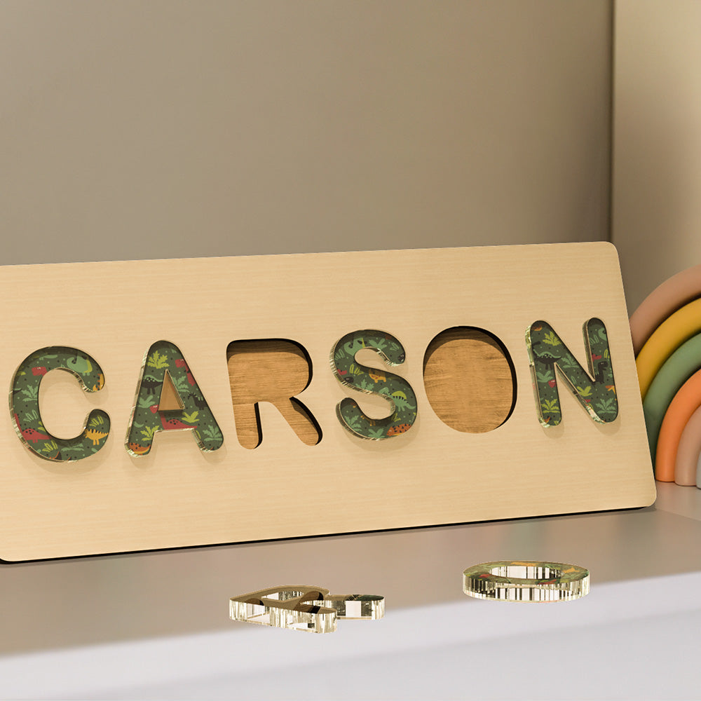 Selection of personalised acrylic name puzzles in different colourways — Montessori baby gifts and keepsakes