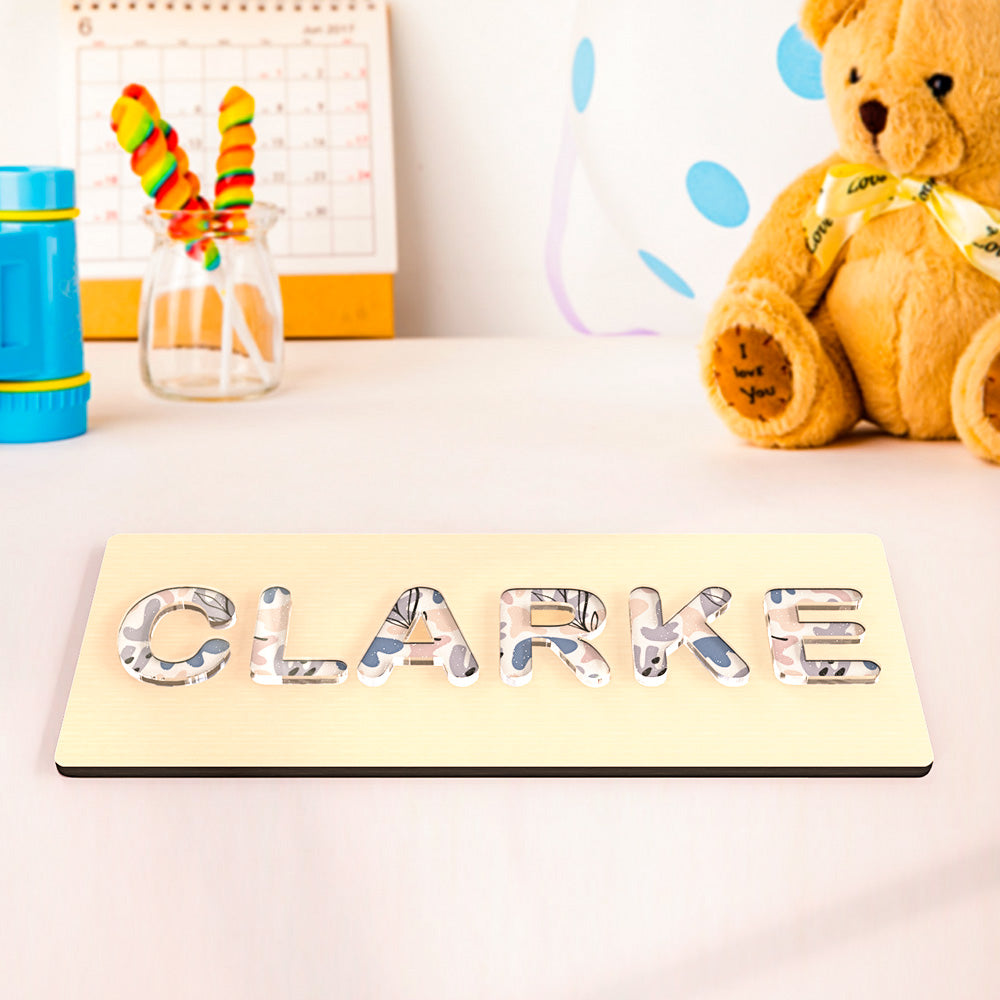Individual letter pieces removed from the wooden base demonstrating puzzle fit and fine motor skill development