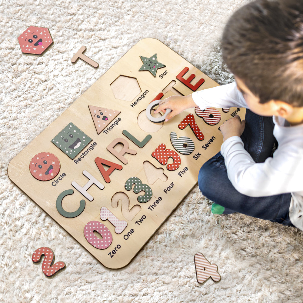 Close-up of colourful wooden letters fitted into a personalised name puzzle showing detail of letter shapes and paint finish