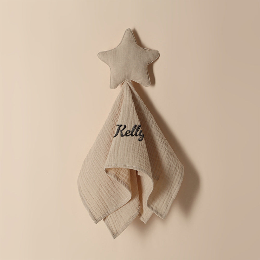 Stack of personalised baby towels in different shades showing star pattern and embroidered name options, premium cotton baby gifts