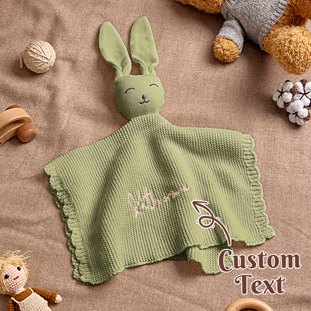 Product close-up: embroidered name detail on the bunny towel.
