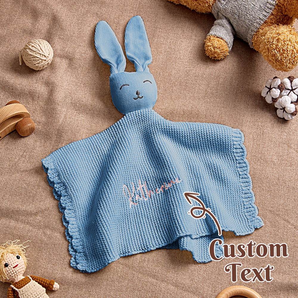 Close-up of embroidered name detail on the bunny towel.