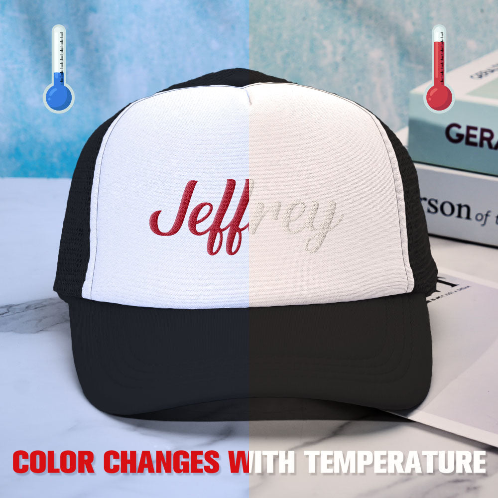 Demonstration of the temperature-sensitive foam changing colour on a custom puff print trucker hat when warmed, an interactive personalised cap feature