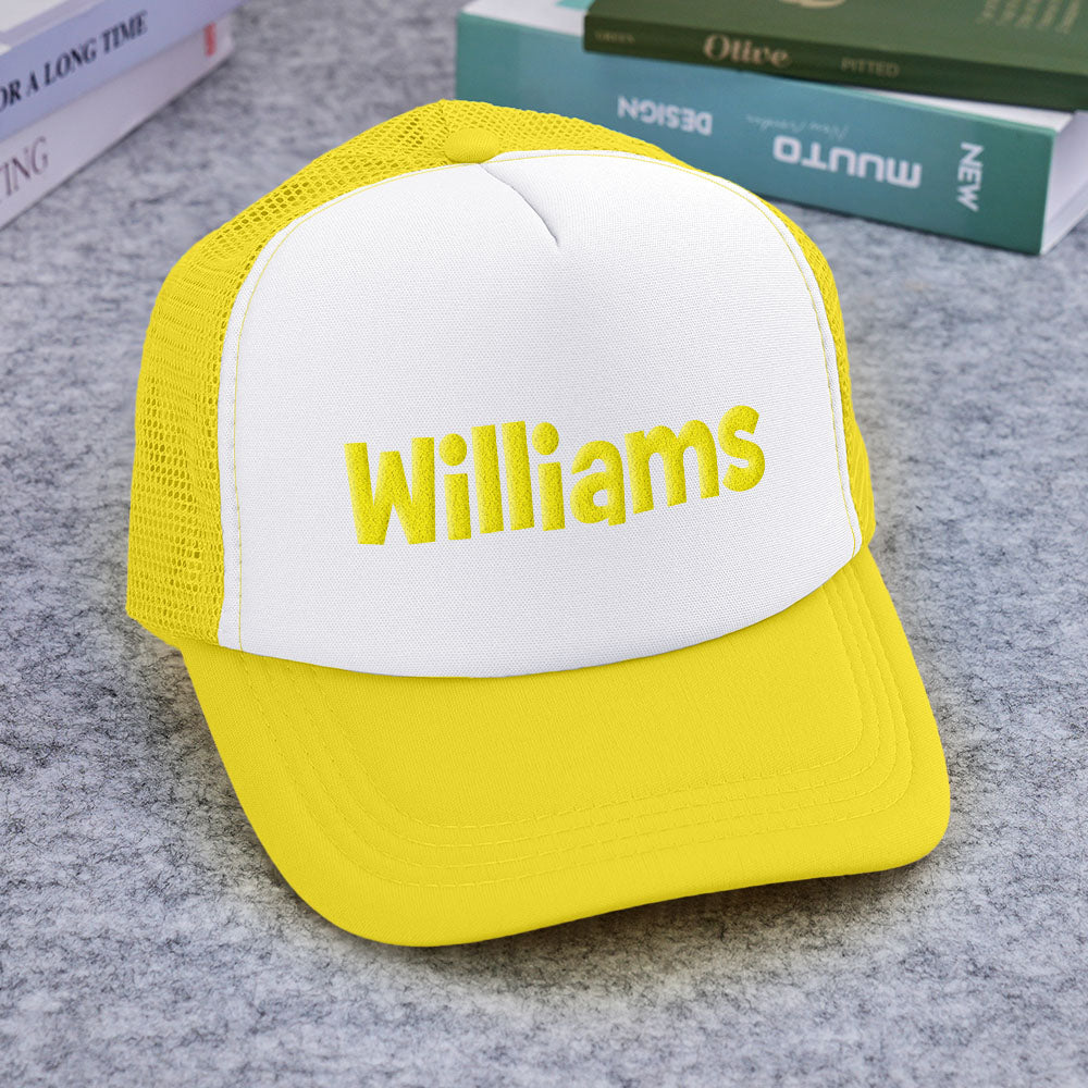 Texture shot of puff-print ink and foam front on custom trucker cap highlighting print clarity and raised effect