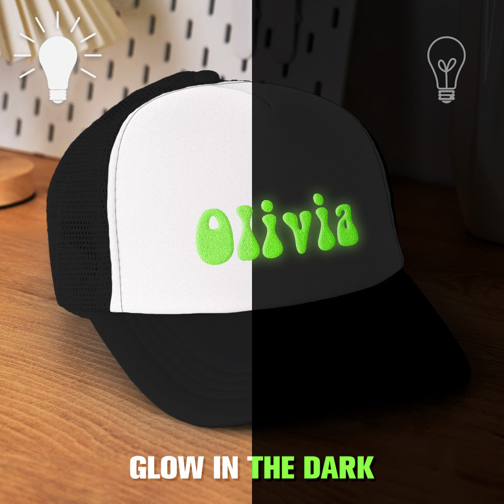 Angled front shot of personalised foam trucker hat with bold puff-print design — custom glow-in-the-dark cap suitable for festivals and school.