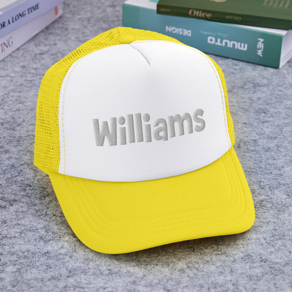 Flat-lay of Personalised Puff Print Trucker Hat with sample custom text to demonstrate customisation options