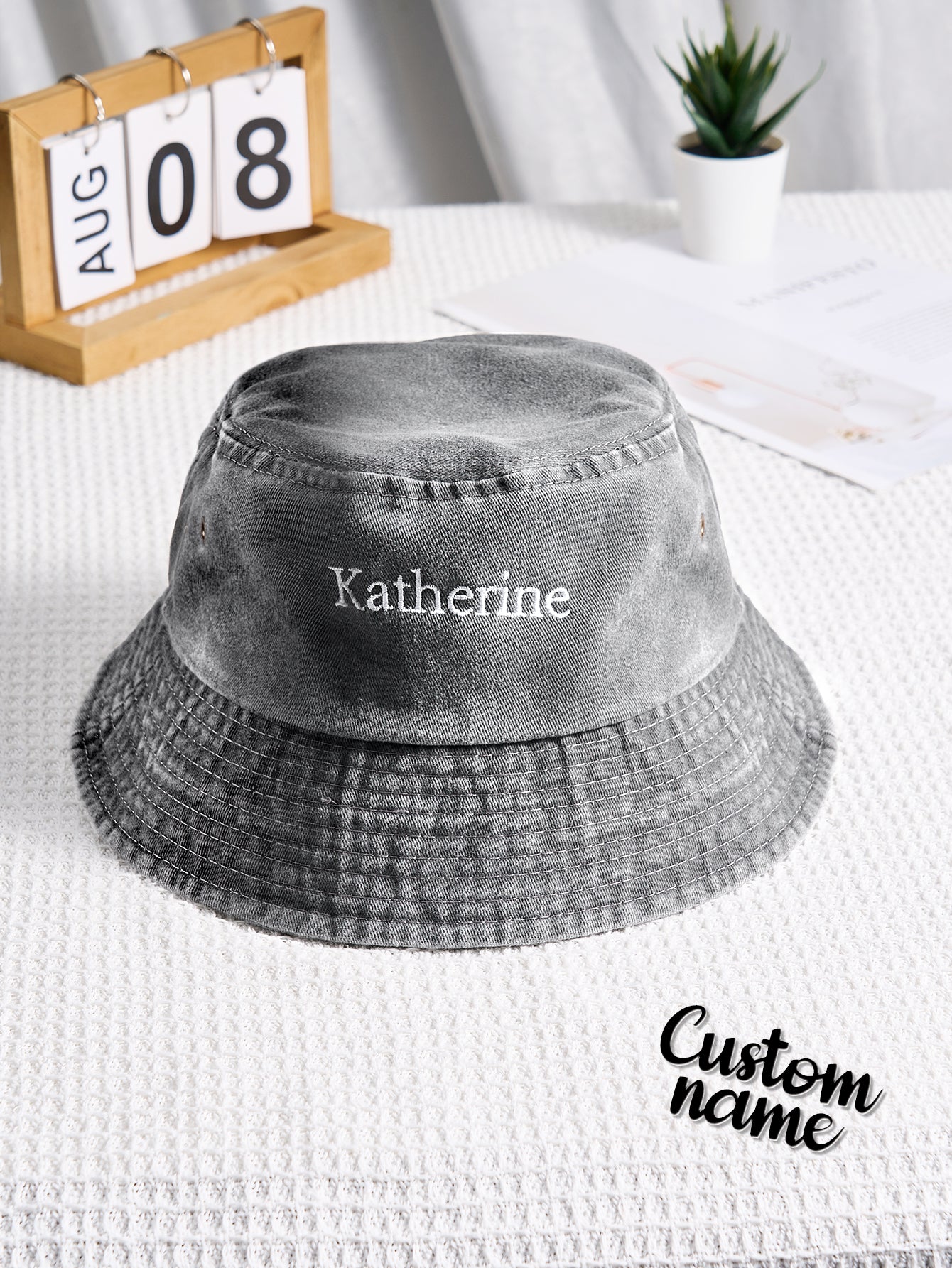 Top view of personalised denim bucket hat showing crown and embroidered text placement — contemporary personalised accessory