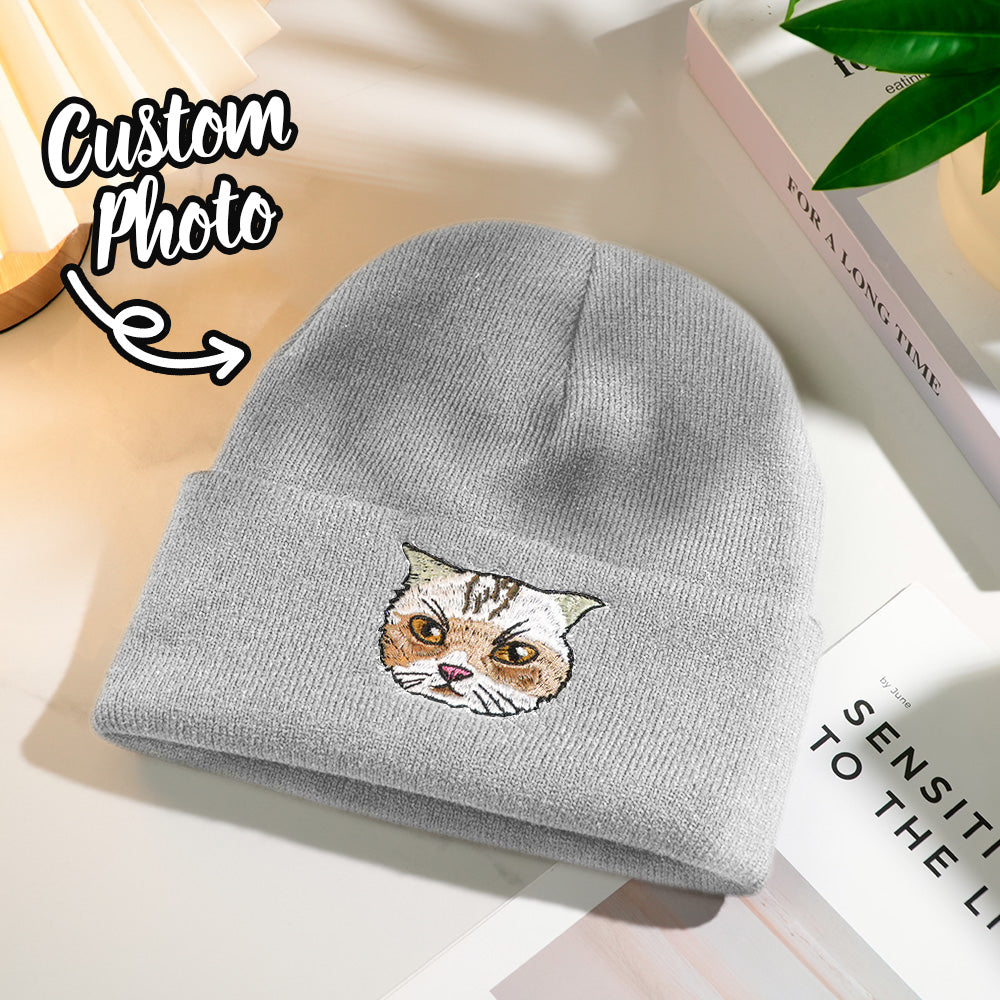 Hands holding a personalised embroidered pet beanie featuring a custom pet portrait — thoughtful customised gift for pet lovers