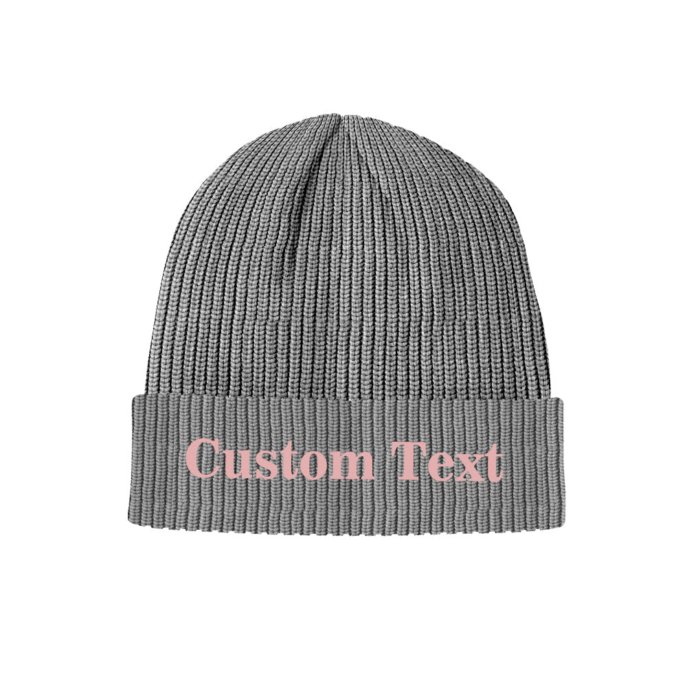 Detailed knit texture close-up of a personalised beanie cuff showing elastic acrylic fibres — custom text knitted winter cap, comfortable and thermal