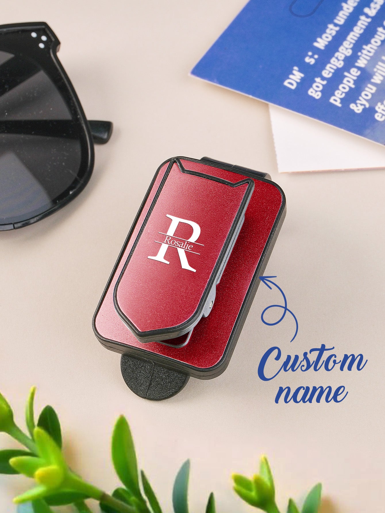 Personalised sun visor clip featuring a custom name, ideal as a thoughtful car gift.