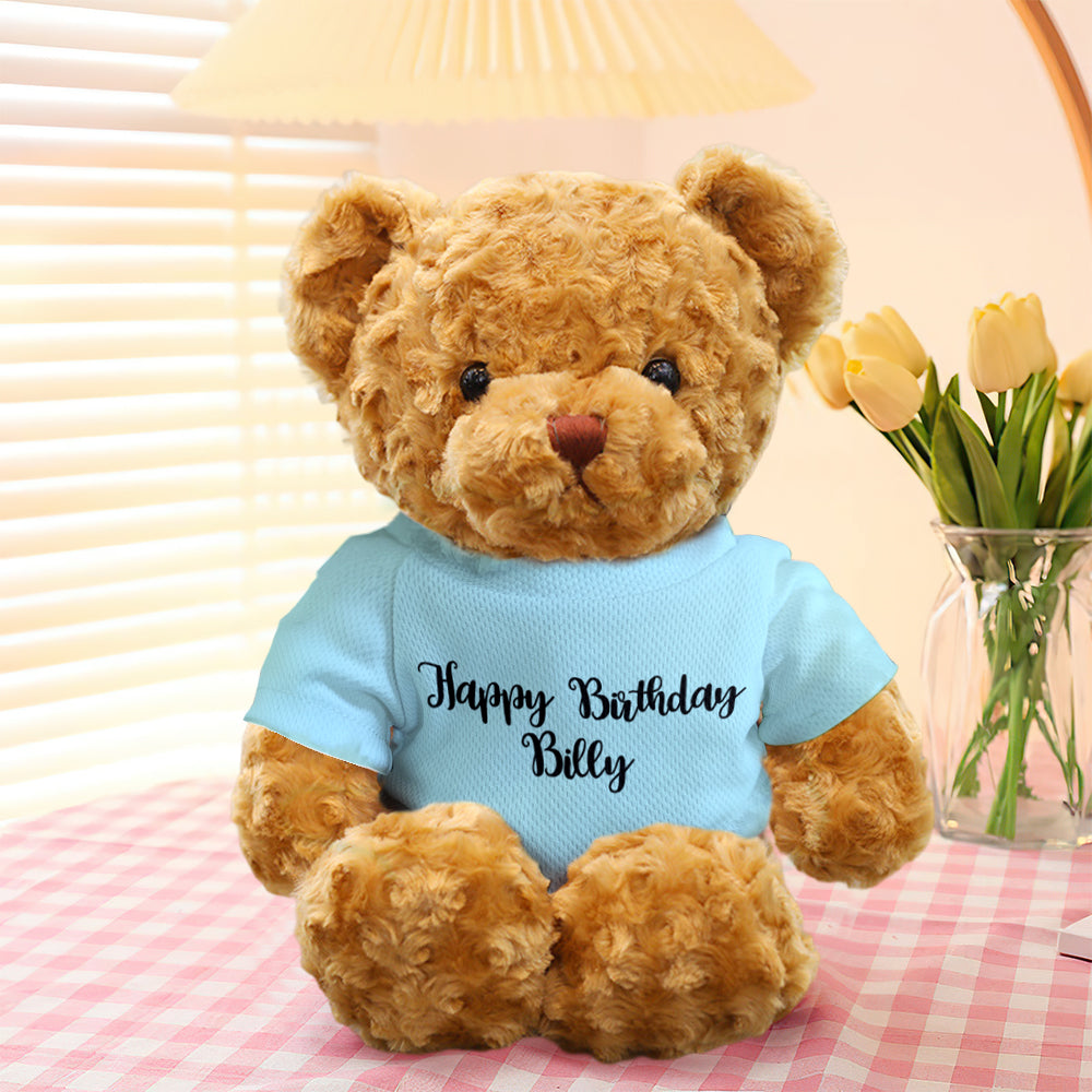Close‑up of personalised embroidered text on teddy bear outfit — custom text personalisation for a unique stuffed animal gift
