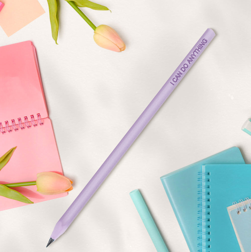 Flatlay of personalised pencils and enrolment stationery — custom name pencils for first day of school keepsakes