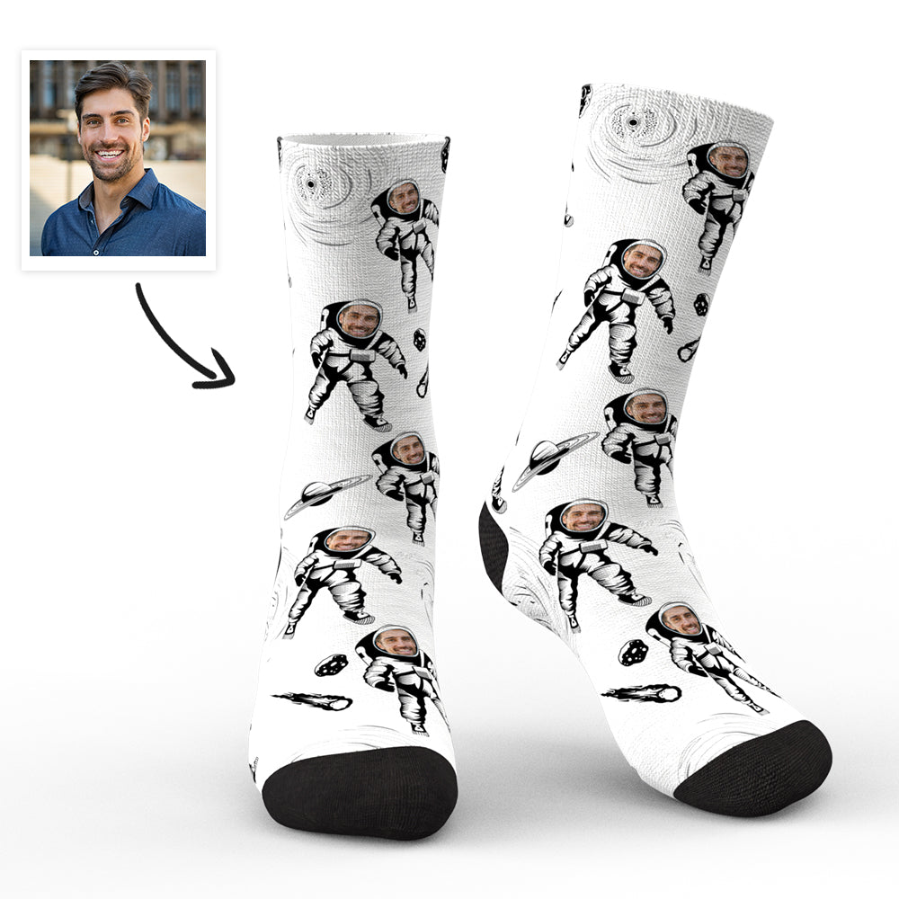 Pair of personalised astronaut socks with a clear custom face preview on the helmet, flat lay on white background — personalised astronaut socks and custom face socks for men, women and teens