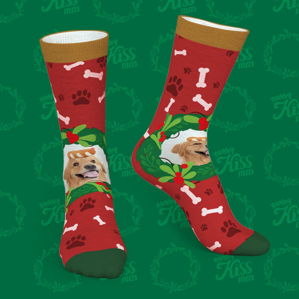 Angled view of green personalised photo pet socks displaying a printed pet portrait and festive mistletoe & bone design – perfect personalised gift
