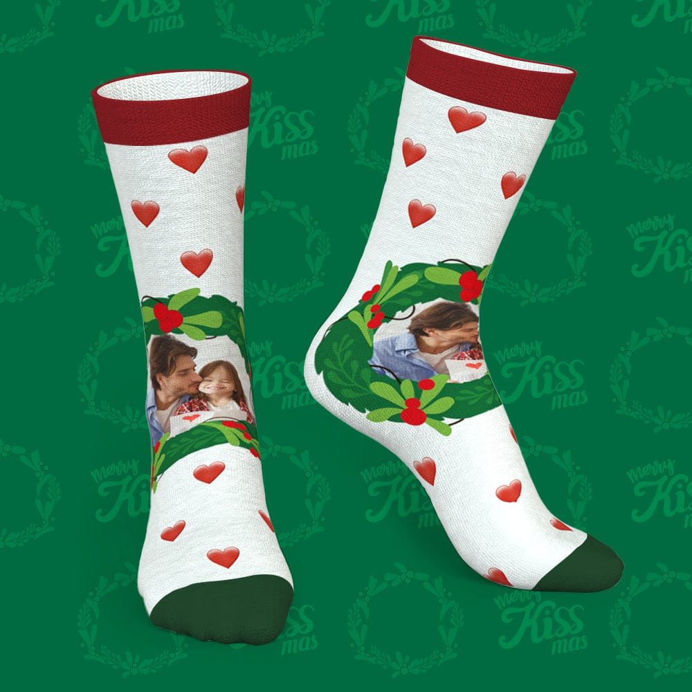 Close-up of red mistletoe and heart Christmas socks personalised with names — soft, machine-washable seasonal accessory
