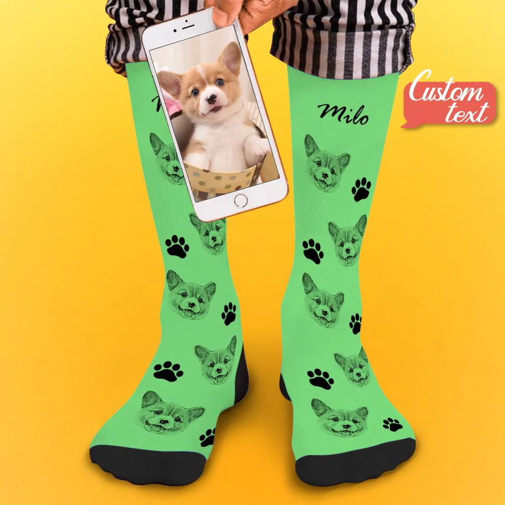 Model wearing personalised pet face photo socks with a clear pet portrait print and personalised name text visible
