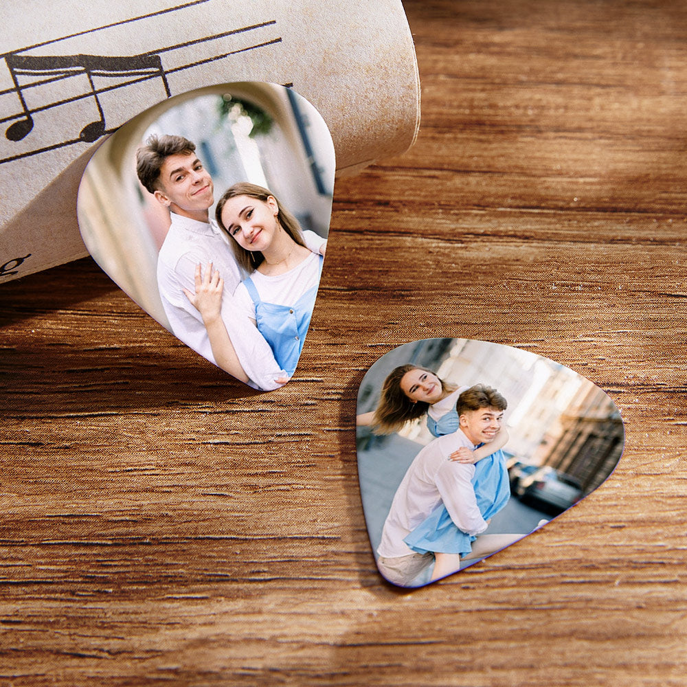 Personalised guitar picks arranged as a gift concept with a handwritten note — romantic personalised photo gift for boyfriend, husband or partner